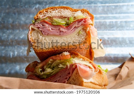 Italian sub sandwich with provolone cheese ham prosciuttini cappacuolo salami and pepperoni