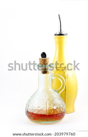 Oil and red vinegar bottles isolated on white