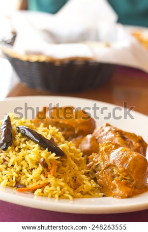 Vegetarian Malai Kofta balls in gravy sauce with tamarind basmati rice