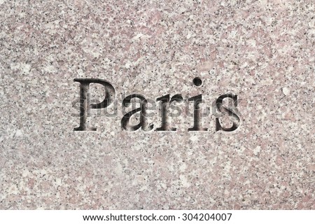 Engraving spelling the city Paris on textured old surface