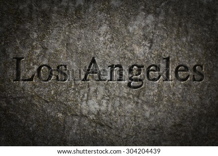 Engraving spelling the city Los Angeles on textured old surface