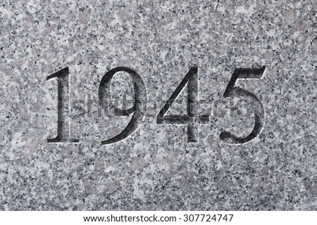 Historical year engraving 1945 on textured old surface