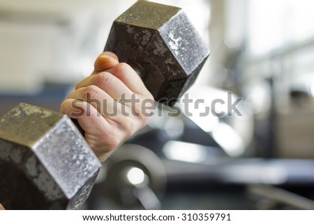 Exercising lifting old textured dumbbell weight gym