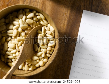 Pine Nut\'s in bowl with recipe card