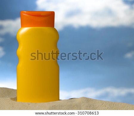 Lotion bottle on a beach