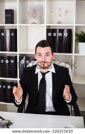 business man in the office shows space for lettering object