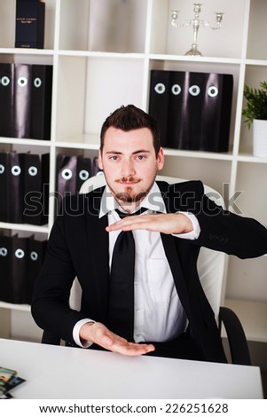 business man in the office shows space for lettering object