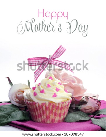 Beautiful pink and white cupcake with bow, hearts and flowers with Happy Mothers Day sample text or copy space for your text here.