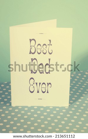 Happy Fathers Day, Best Dad Ever, greeting card on blue and polka dot background with retro vintage style filter.