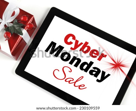 Cyber Monday Sale shopping message on black computer tablet device on white background with Christmas gift.