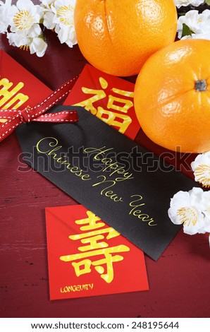 Happy Chinese New Year celebration party table on red wood background.