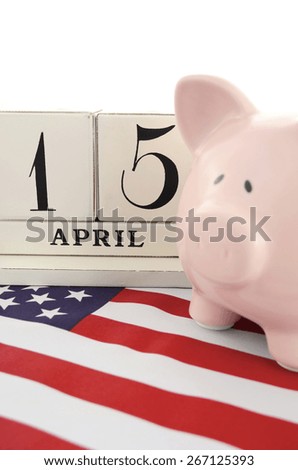 April 15 calendar for USA Tax Day with piggy bank on stars and stripes flag against a white background.