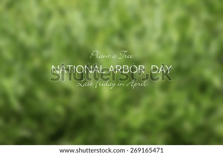 Arbor Day concept with blurred background of lush green leaves with National Arbor Day text and title.