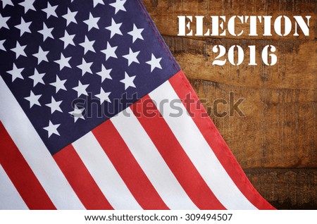 USA 2016 Presidential Election with American Stars and Stripes flag on wood background with added text.