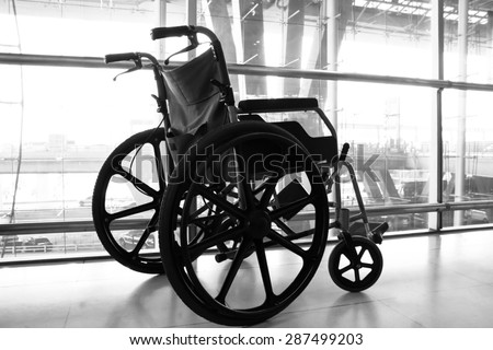 Black and white Wheelchair service in airport terminal