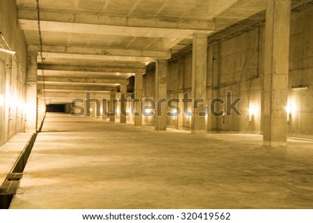 Empty industrial garage room interior with concrete floor and wall background, vintage color style