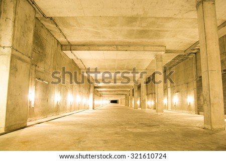 Empty industrial garage room interior with concrete floor and wall background, vintage color style