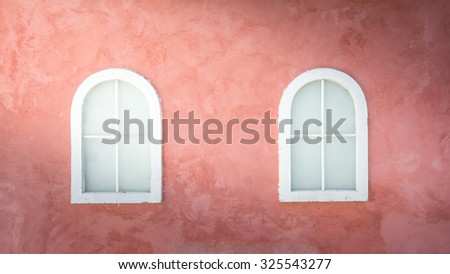 light on Vintage window on nice color cement wall can be used for background, vintage color style
