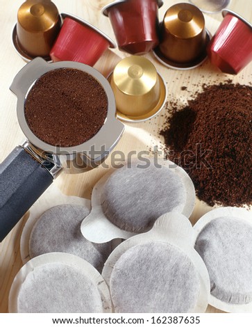 Prepackaged coffee portions for filtering filled with the required amount of grains for a single serving of espresso coffee, with a stainless steel filter filled with freshly ground coffee beans