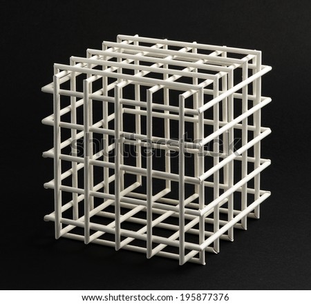 Open empty wooden cubic frame with equilateral sides in a typical geometric cube form on a black background in square format
