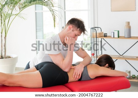 Similar – Image, Stock Photo Therapist doing loin massage for patient in clinic