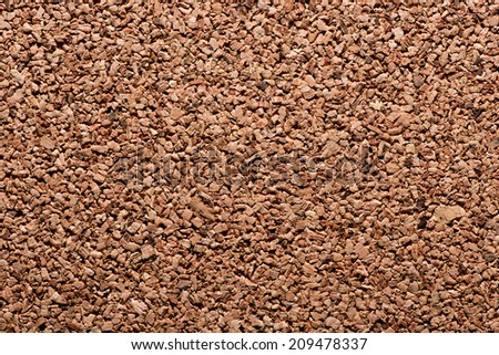 Background texture of a natural cork panel made from the inner bark of a tree used in construction for insulation due to its fire resistant qualities