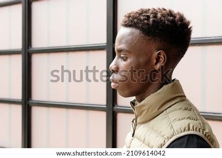 Similar – Image, Stock Photo Sad boy looking down in studio