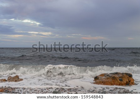 Ocean waves crashing against shore (Cape Breton, Nova Scotia, Canada)