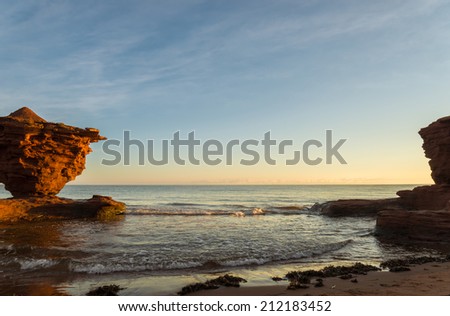 Red sandstone rocks at high tide (Green Gables Shore, Prince Edward Island , Canada)