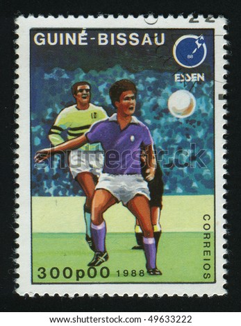 GUINEA-BISSAU - CIRCA 1988: stamp printed by Guinea - Bissau, shows soccer players and ball. 1988 Sumer olimpics, Seoul, circa 1988.