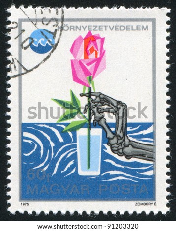HUNGARY - CIRCA 1975: A stamp printed by Hungary, shows Skeleton hand reaching for rose in water glass, circa 1975