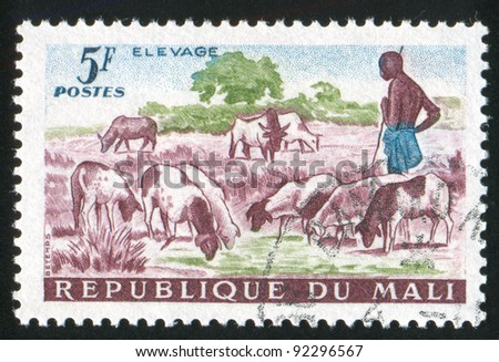 MALI - CIRCA 1961: A stamp printed by Mali, shows Shepherd and Sheep, circa 1961