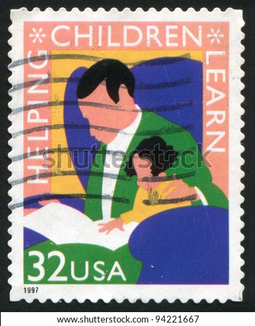 UNITED STATES - CIRCA 1997: stamp printed by United States of America, shows reading man and child, circa 1997