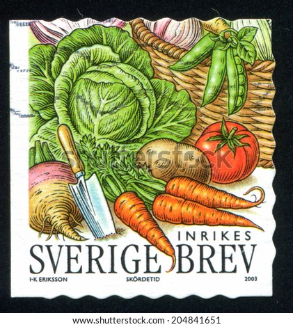 SWEDEN - CIRCA 2003: stamp printed by Sweden, shows Trowel, garlic, peas, cabbage, tomato, potato, turnip, carrots, circa 2003