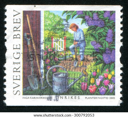 SWEDEN - CIRCA 2005: stamp printed by Sweden, shows Man tending vegetable garden, circa 2005