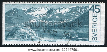 SWEDEN - CIRCA 1970: stamp printed by Sweden, shows Boat on mountain lake in Stora Sjofellet National Park, circa 1970