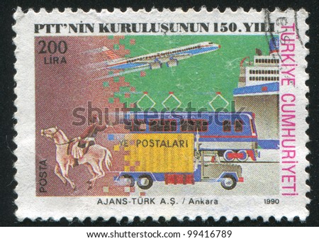 TURKEY - CIRCA 1990: stamp printed by Turkey, shows Post rider, truck, train, airplane, ship, circa 1990