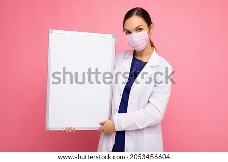 Similar – Image, Stock Photo Woman holds protective mask in hands at city street