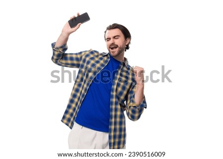 Similar – Image, Stock Photo Brutal man browsing smartphone in backyard