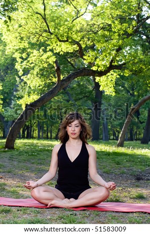 Lotus yoga position at sunset in the park