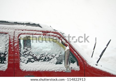 snow covers on car\'s window as snowing weather