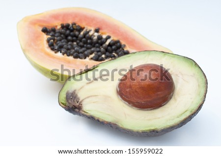 avocado and papaya isolated on white background