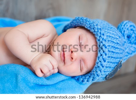 The sweet dream of newborn in blue hat