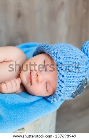The sweet dream of newborn in blue hat