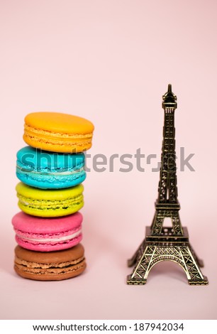 Traditional french colorful macarons wuth the symbol of Paris