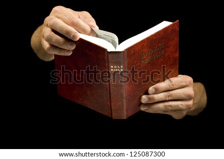 Close-Up Of A Man Holding The Holy Bible Stock Photo 125087300 ...