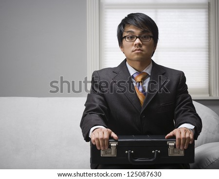 Young asian man waiting for interview