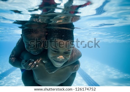 Portrait Of Two African American Boys Swimming Underwater Stock Photo ...