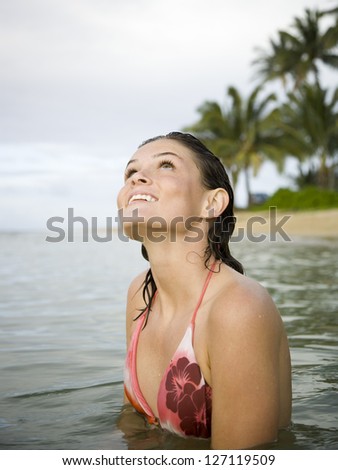 Profile of a teenage girl in the sea