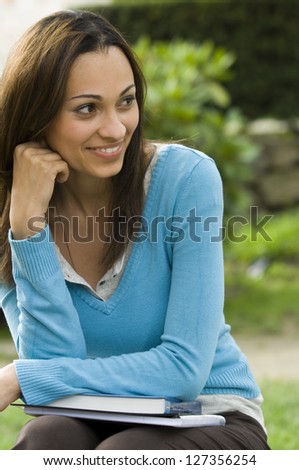 Female student smiling and looking away